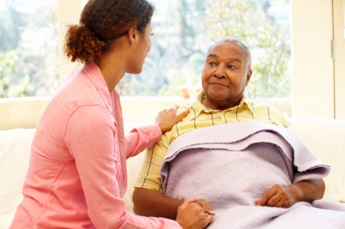 caregiver checking her patient